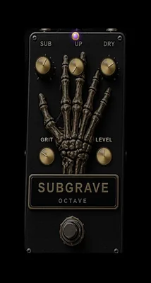 SUBGRAVE stompbox: brass knobs over a sculpted bone hand